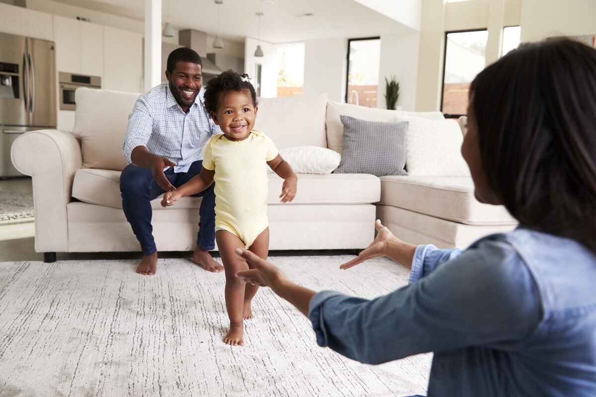 Baby learning to walk meets one of her gross motor milestones