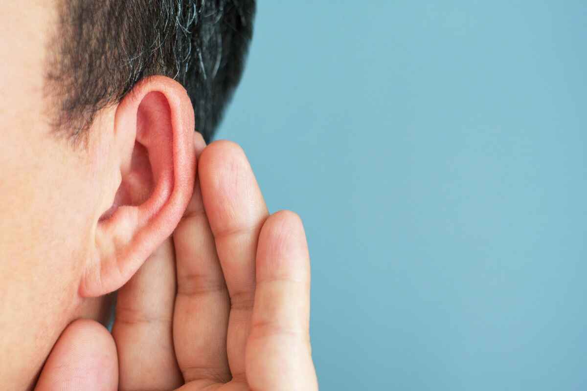 Man with hearing loss strains to listen