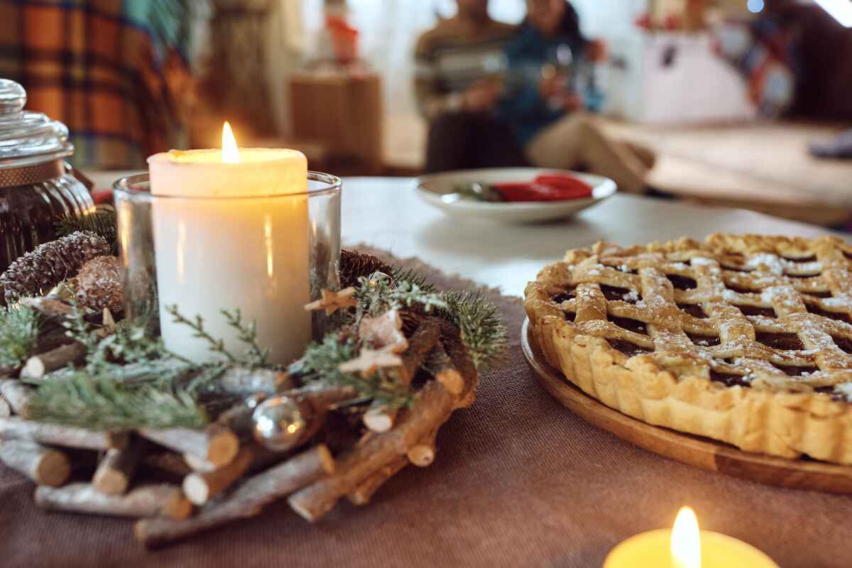 Candle burning on a holiday table