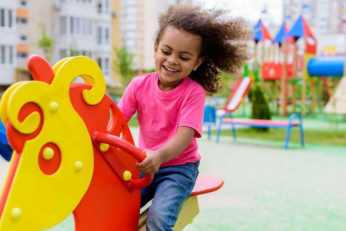 Girl plays safely on a playground