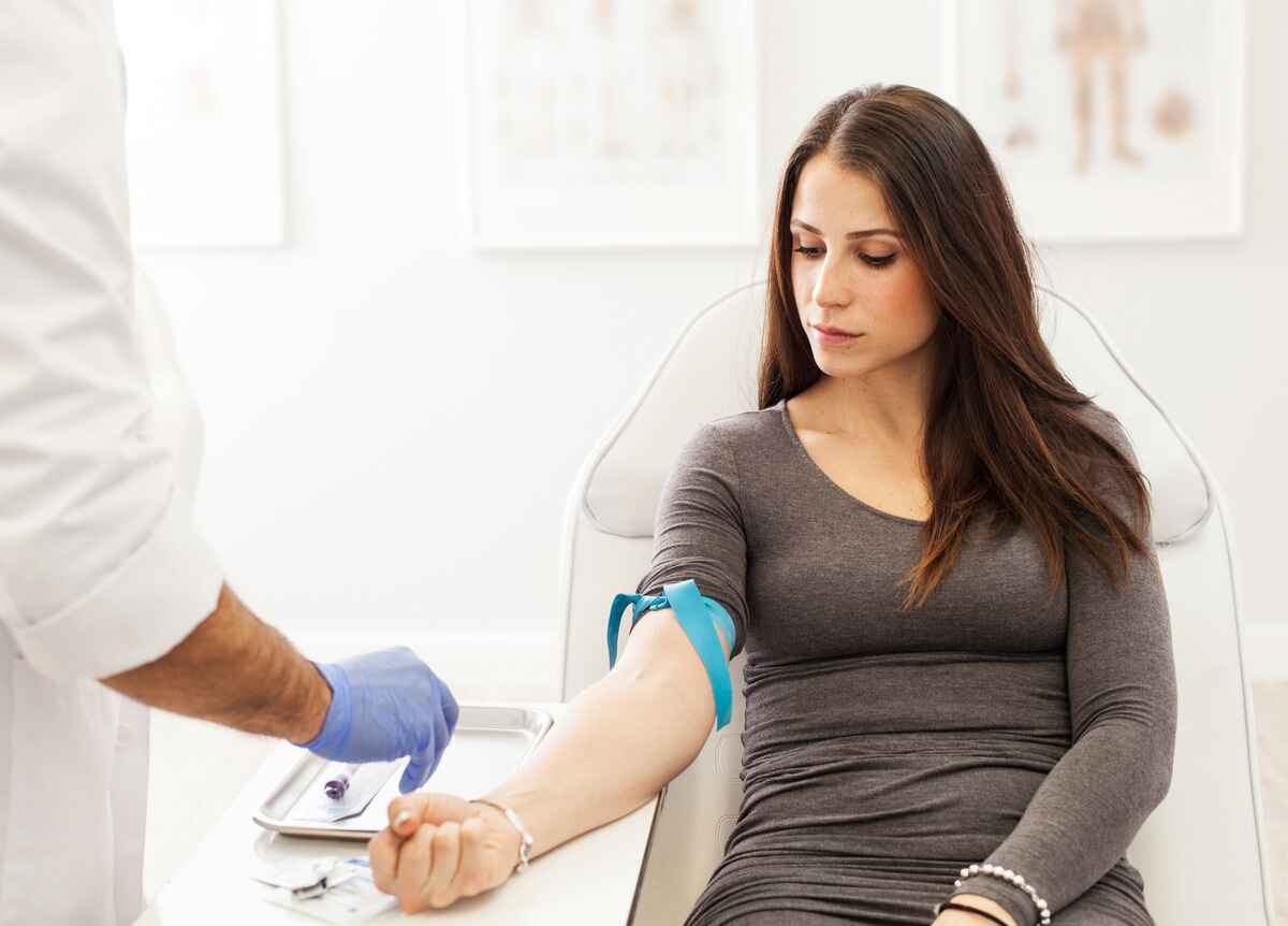 Woman prepares for blood draw to test for anemia